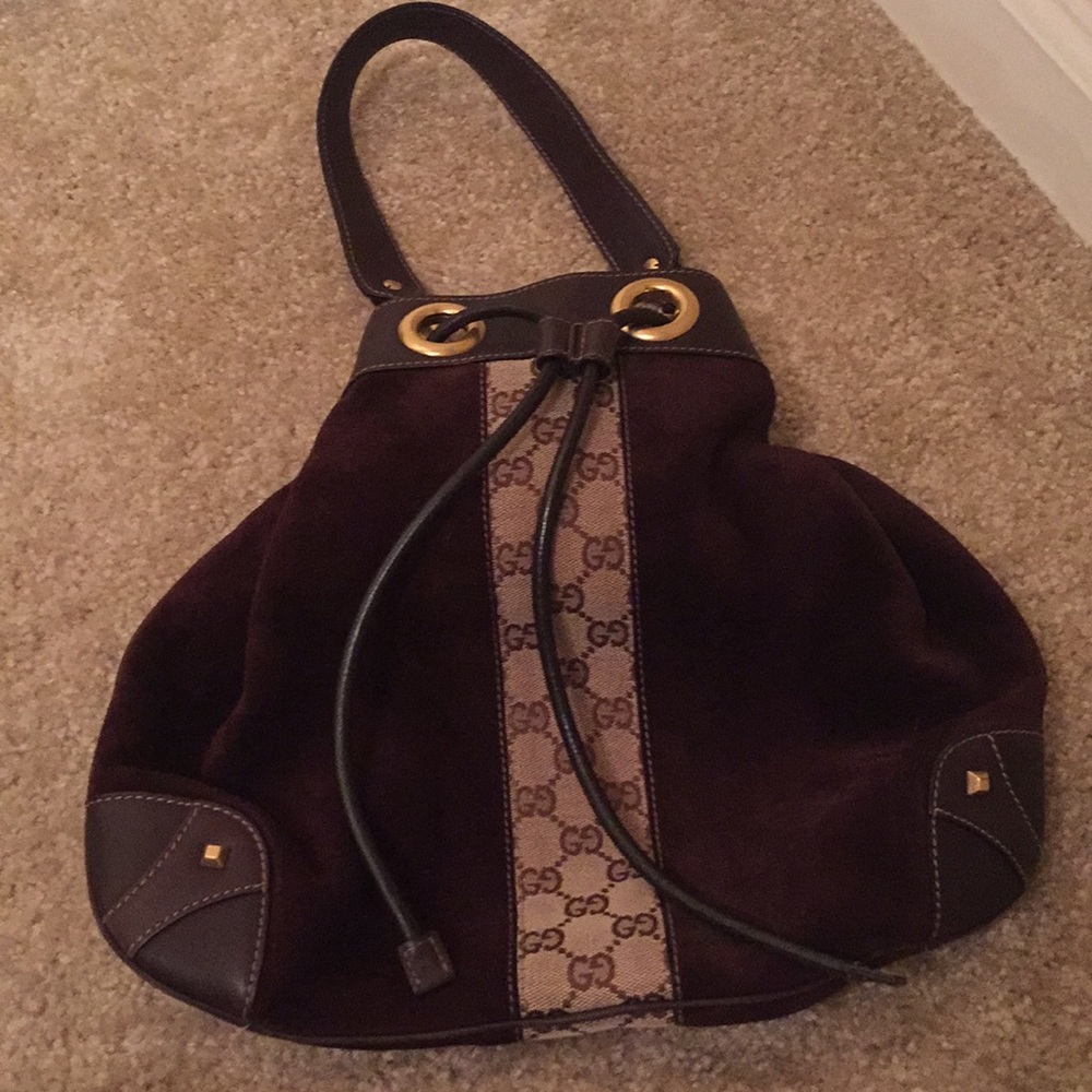 Gucci drawstring bag with stunning Gold hardware